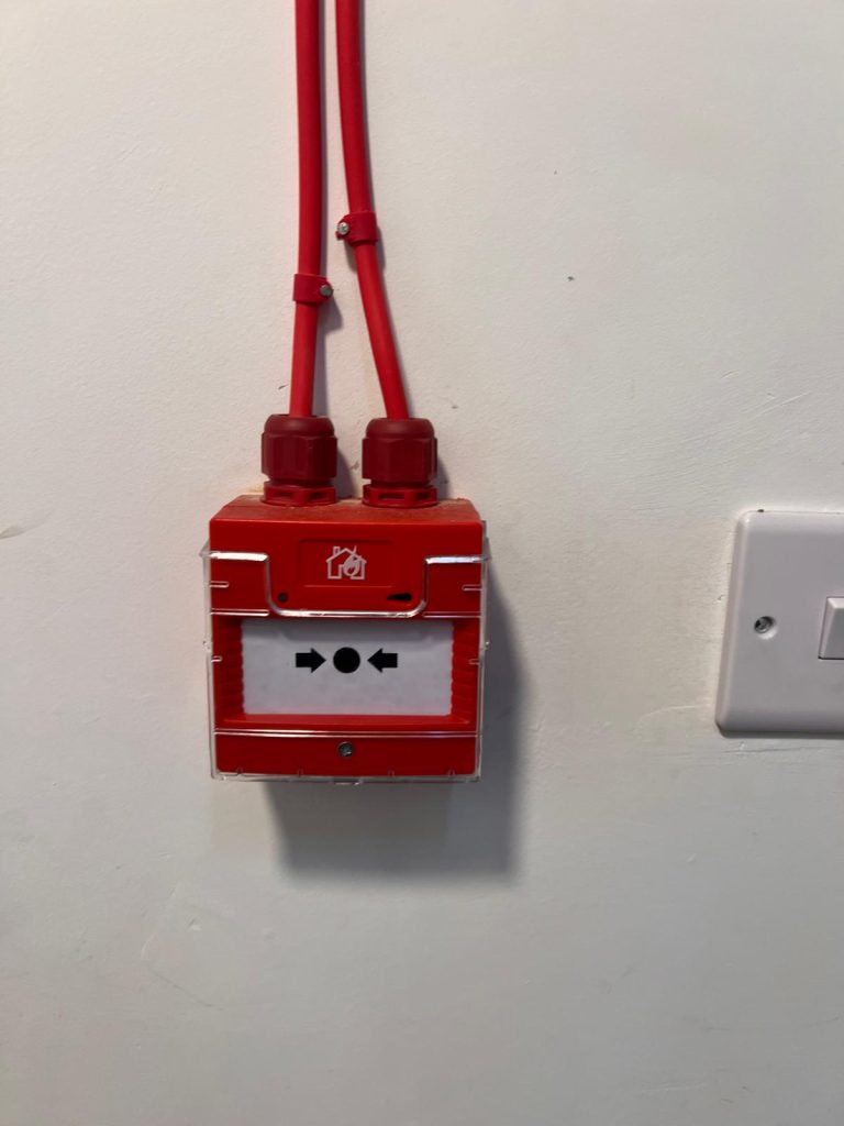 Manual fire alarm call point tested during panel upgrade in Bow